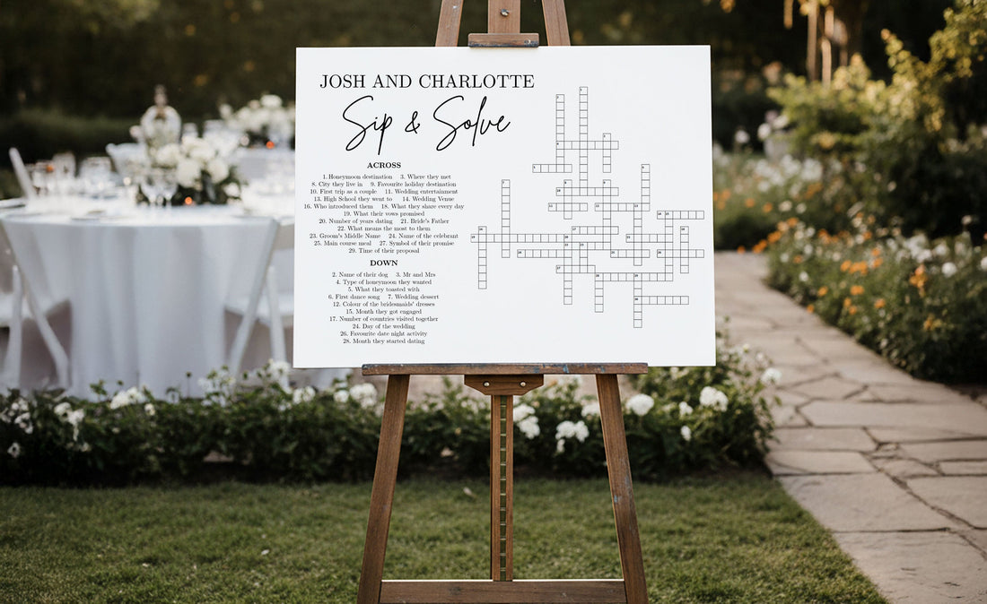 Personalised Sip & Solve wedding crossword sign on a wooden easel at a wedding reception
